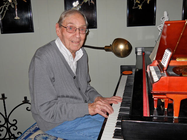 Don playing the same piano that he played when he was fourteen years old. His father was a concert pianist.