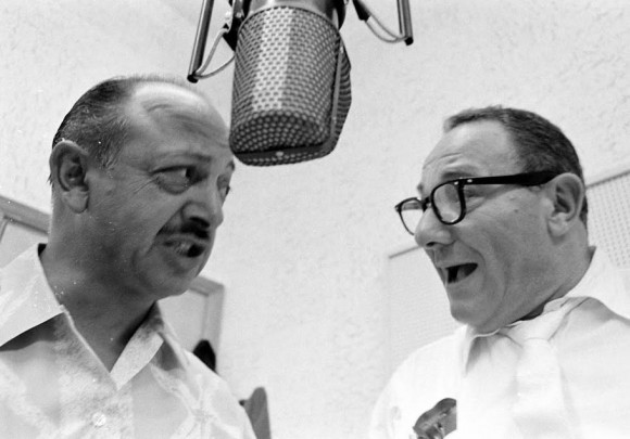 Mel Blanc (left) and Alan Reed recording the voices of Barney Rubble and Fred Flintstone, respectively. - hb-life-f-580x405