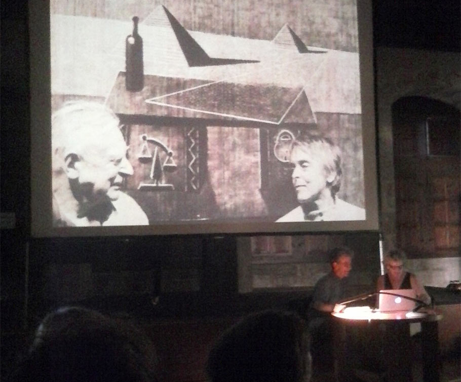 Jacques Drouin and Michele Lemieux lecture about the pin screen, while sitting in front of a photo of Alexandre Alexeieff and Claire Parker. Click to enlarge. (Photo by Tess Martin.)