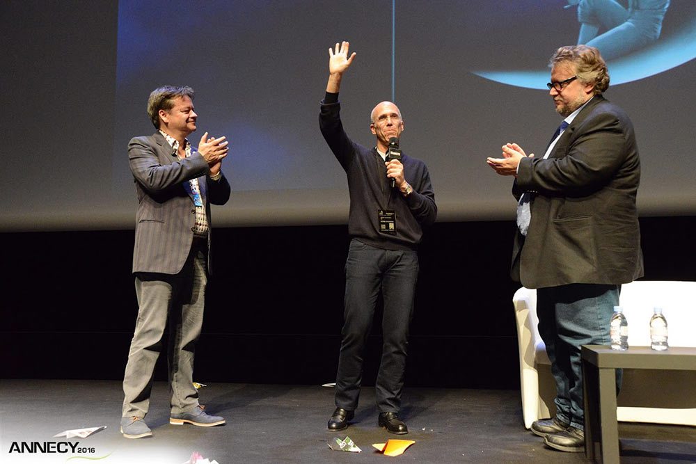 Annecy's artistic director Marcel Jean with Jeffrey Katzenberg, who was presented with a lifetime pass to the festival, and director Guillermo del Toro. (Photo: D. Bouchet/CITIA)