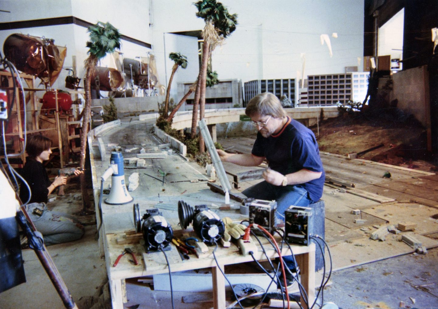Dennis Skotak (foreground) works on the LA miniature, with Samantha Stevens at left.