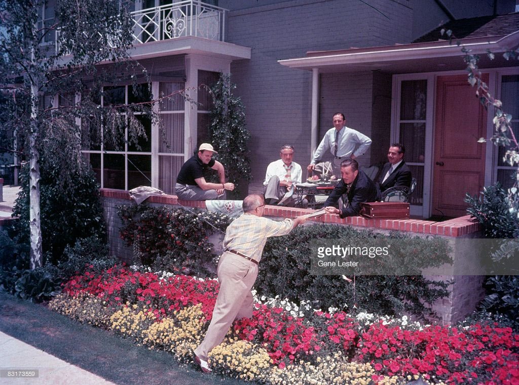 Walt Disney in a meeting at his home.