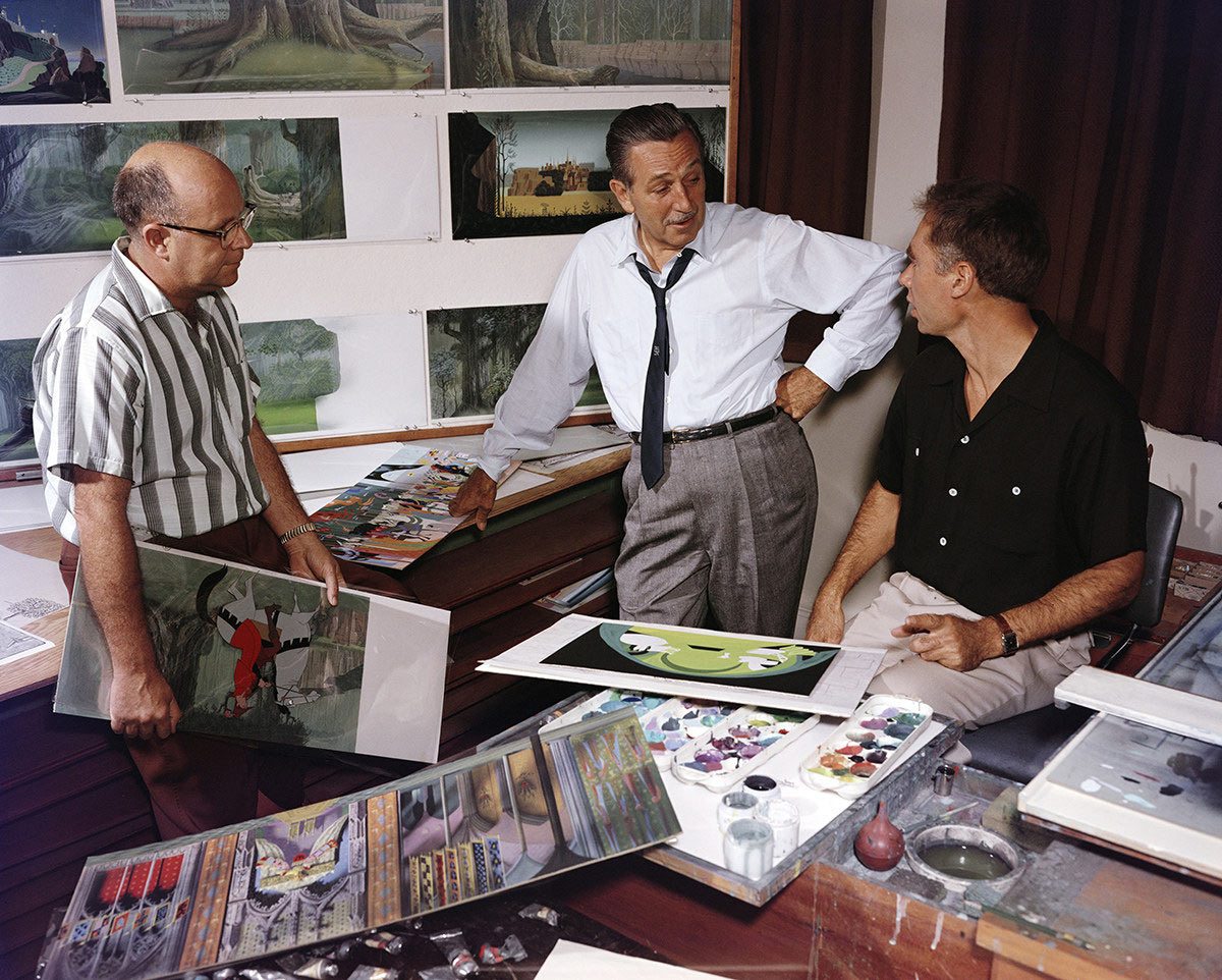 From left to right: unidentified, Walt Disney, "Sleeping Beauty" production designer Eyvind Earle.