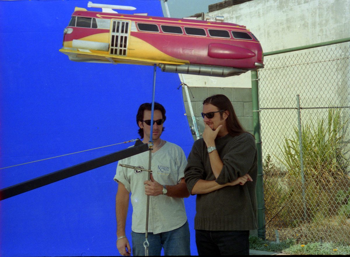 Members of Vision Crew Unlimited shoot a miniature spacecraft.