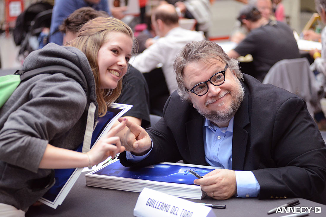 Guillermo del Toro meets a fan at a signing session.