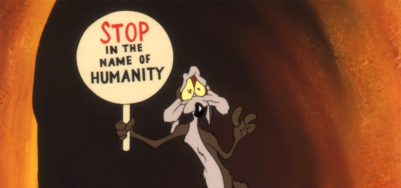 Wile E. Coyote holding sign. 