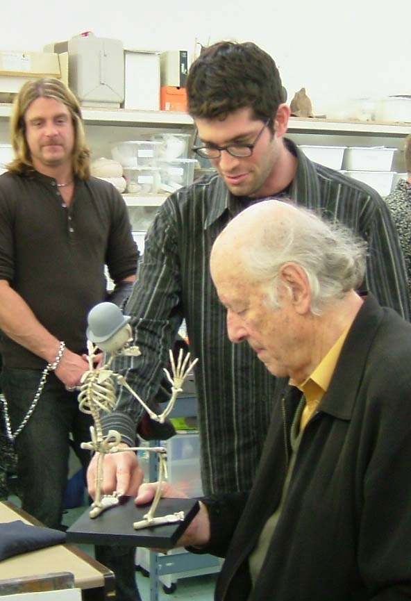 Ray Harryhausen inspects 'Corpse Bride' skeleton puppets.